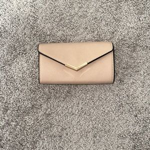 Nude clutch crossbody purse. Three compartments with three card holder slots.